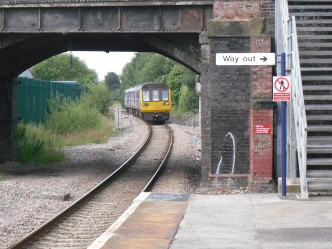 Train approaching Reddish South Photo of train approaching Reddish South station