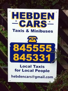 Photo of a sign advertising Hebden Cars: "Local Taxis for Local People"