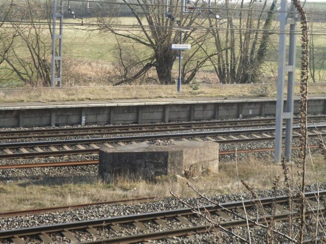 Photo of concrete base for the former footbridge