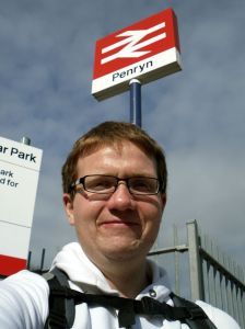 Robert stands under the Penryn totem