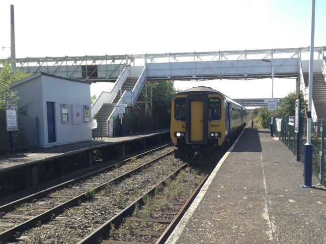 Train arrives at Stanlow & Thornton station